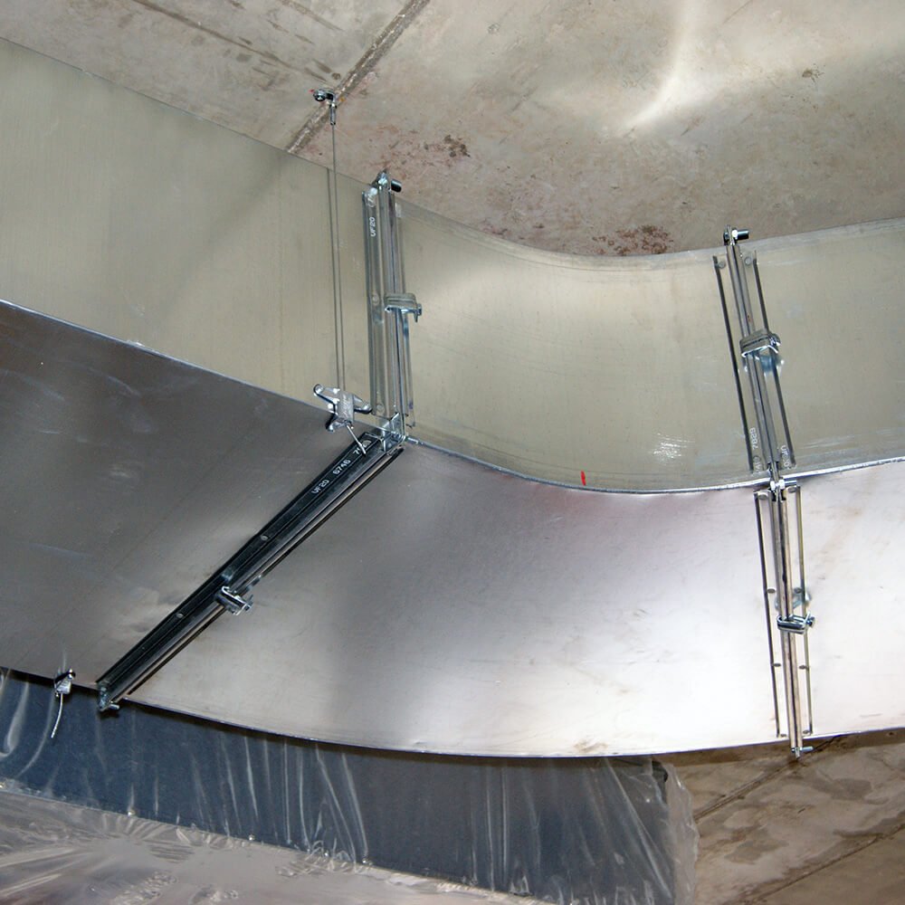 Technician replacing damaged attic duct section to restore airflow in Bay County home