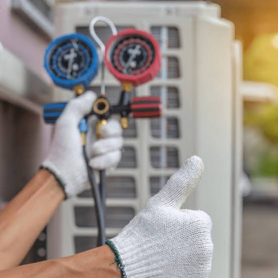 Technician performing seasonal HVAC maintenance on an outdoor unit beside a Florida home
